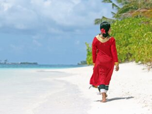 Maldives, local lady on the beach